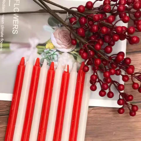 Decorative red and white pillar candles for table centerpiece styling